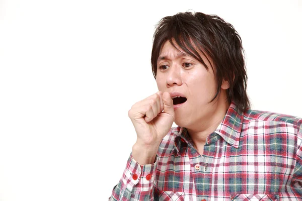 Young Japanese man coughing　 — Stockfoto